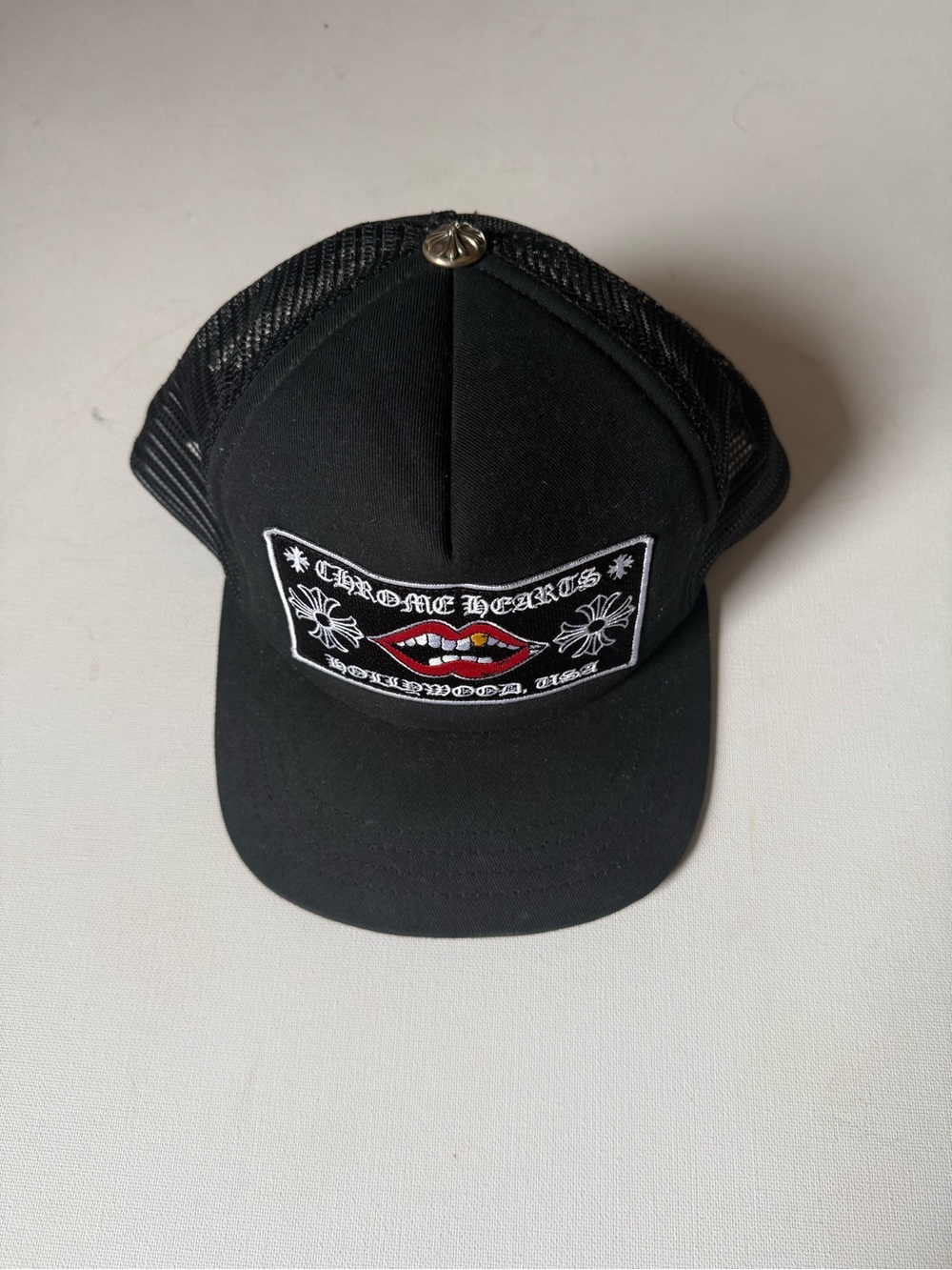 Chrome Hearts Black Trucker Cap with Red Accent Lip Patch